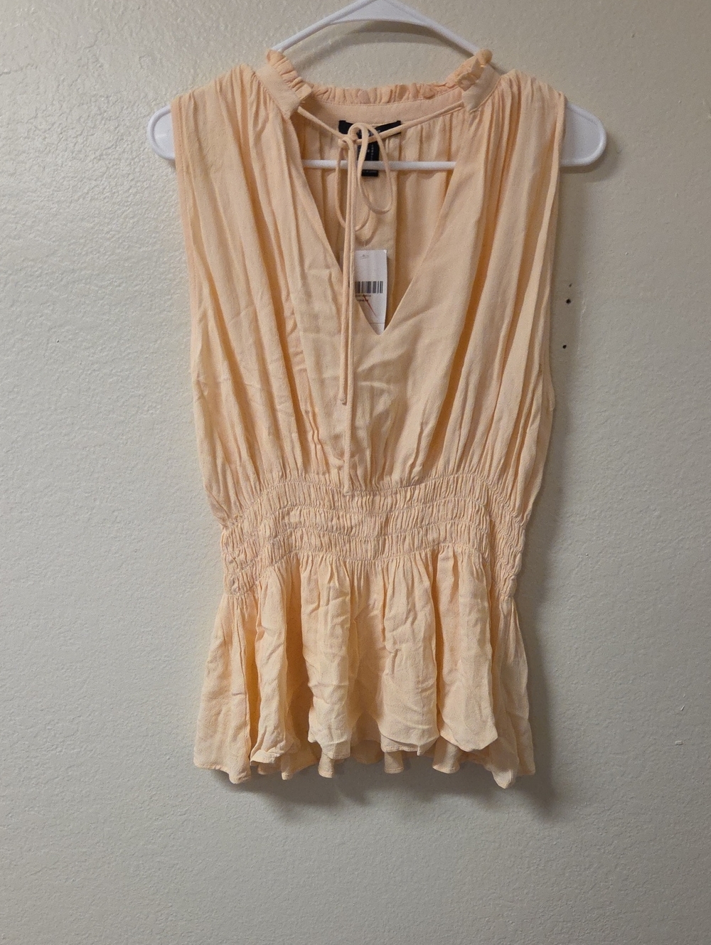 Forever 21 Peach Sleevelessâ Peplum Top with Tie Neck